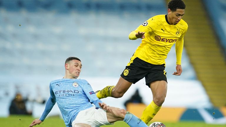 Phil Foden tries to dispossess Jude Bellingham