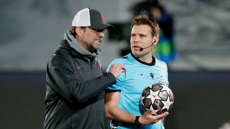 Jurgen Klopp of Liverpool FC talking to referee Felix Brych during the UEFA Champions League match between Real Madrid v Liverpoo