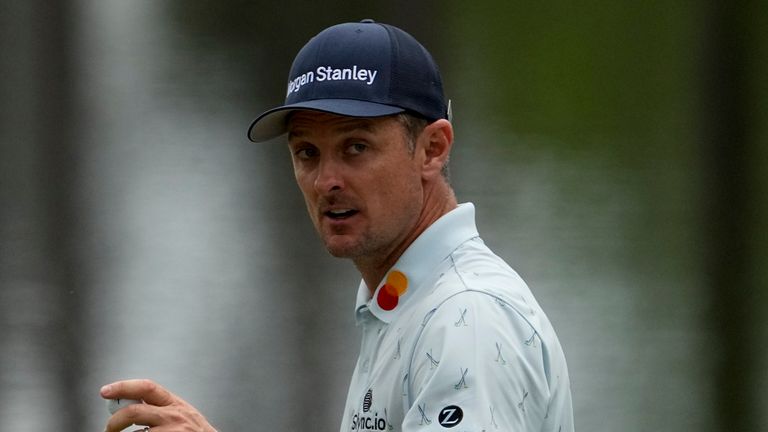 Justin Rose, of England, holds up his ball after a birdie on the 16th hole during the first round of the Masters golf tournament on Thursday, April 8, 2021, in Augusta, Ga. (AP Photo/David J. Phillip)