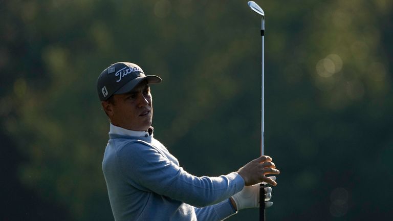 Justin Thomas watches his tee shot on the 12th hole during a practice round for the Masters 