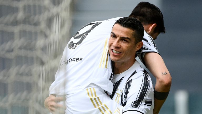 Cristiano Ronaldo celebrates Alvaro Morata's goal for Juventus against Genoa