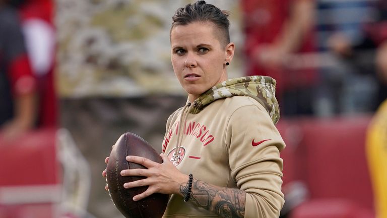 San Francisco 49ers assistant coach Katie Sowers watches as players warm up before an NFL football game between the 49ers and the Seattle Seahawks in Santa Clara, Calif., Monday, Nov. 11, 2019. (AP Photo/Tony Avelar)