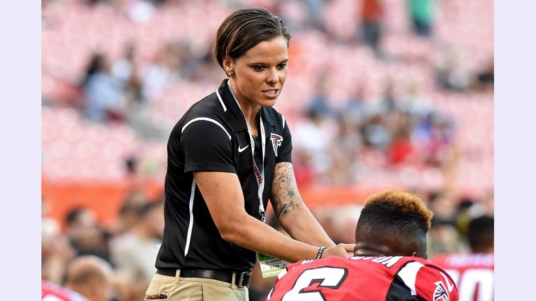 CLEVELAND, OH - AUGUST 18, 2016: Offensive assistant Katie Sowers of the Atlanta Falcons walks with wide receiver Corey Washington #6 prior to a preseason game against the Cleveland Browns on August 18, 2016 at FirstEnergy Stadium in Cleveland, Ohio. Atlanta won 24-13. (Photo by: 2016 Nick Cammett/Diamond Images via Getty Images)