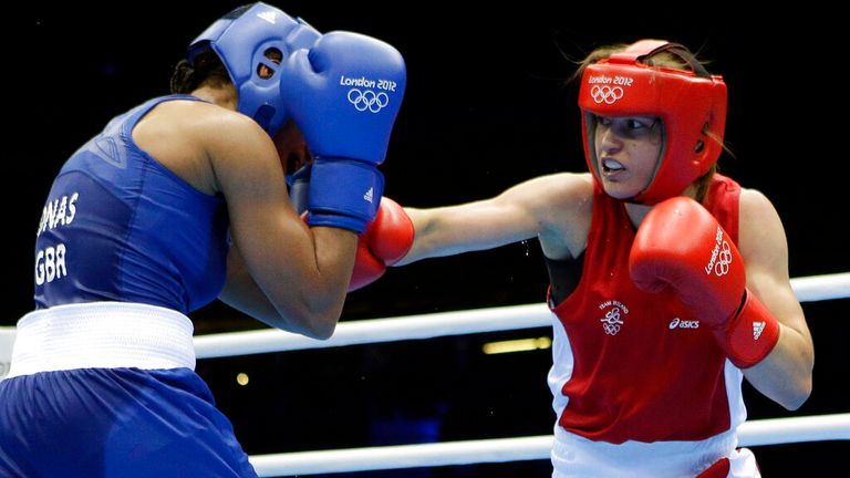 Ireland's Katie Taylor, right, fights Britain's Natasha Jonas in a women's lightweight 60-kg quarterfinal boxing match at the 2012 Summer Olympics, Monday, Aug. 6, 2012, in London. (AP Photo/Patrick Semansky)