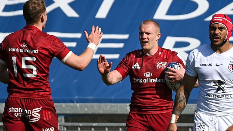 3 April 2021; Keith Earls of Munster, centre, celebrates with team-mate Mike Haley, left, after scoring his side's second try during the Heineken Champions Cup Round of 16 match between Munster and Toulouse at Thomond Park in Limerick. Photo by Ramsey Cardy/Sportsfile