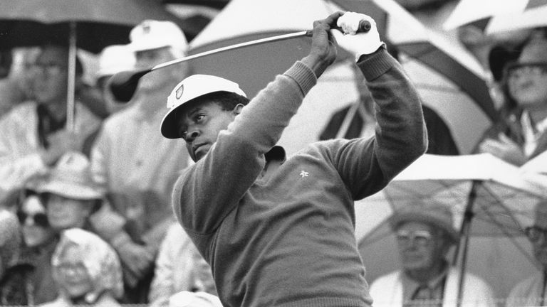 Lee Elder watches the flight of his ball as he tees off in the first round of play at the Masters in Augusta, Ga., on April 10, 1975