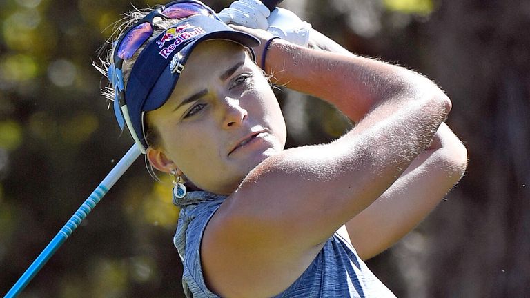 Lexi Thompson hits a tee shot on the fifth hole during the final round of the Gainbridge LPGA golf tournament Sunday, Feb. 28, 2021, in Orlando, Fla. (AP Photo/Stan Badz)