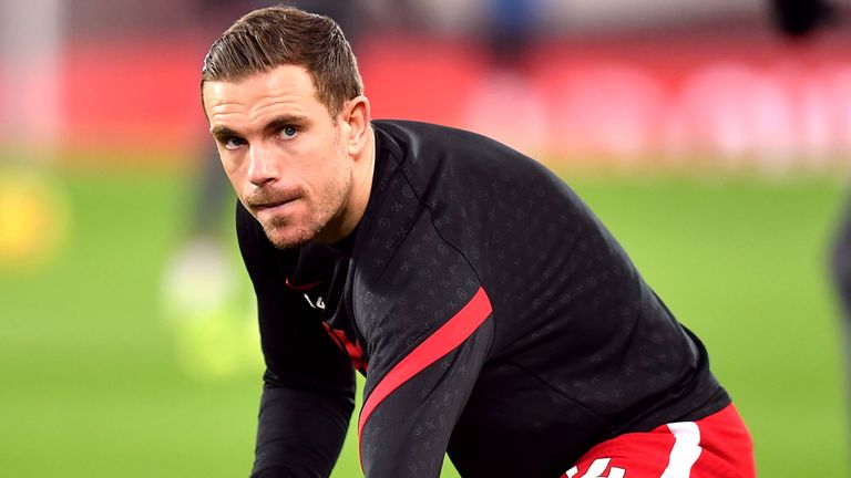 Liverpool's Jordan Henderson warms up before the Premier League match against Brighton