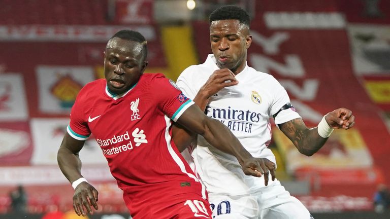 Sadio Mane and Vinicius Junior battle for the ball