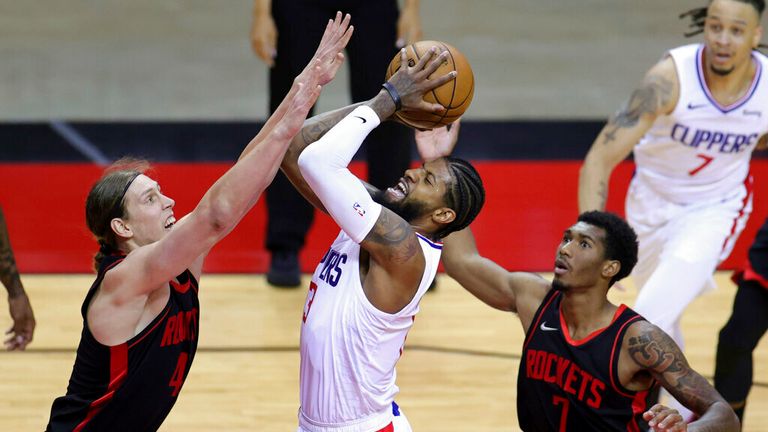 AP - Los Angeles Clippers&#39; Paul George looks to shoot against Houston Rockets&#39; Kelly Olynyk (41) and Armoni Brooks