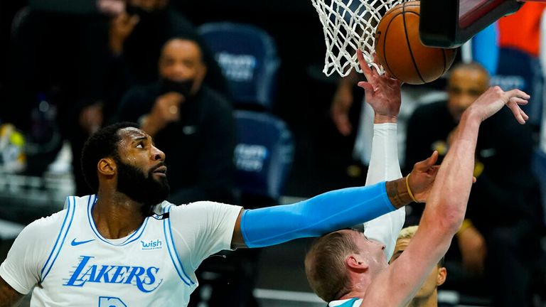 Los Angeles Lakers center Andre Drummond (2) vies for a rebound with Charlotte Hornets center Cody Zeller 