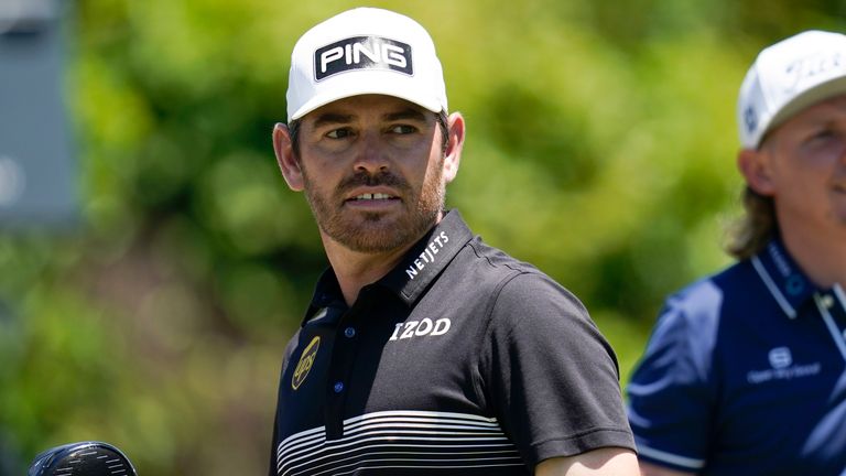 Louis Oosthuizen, of South Africa, left, watches his shot off the second tee during the final round of the PGA Zurich Classic golf tournament at TPC Louisiana in Avondale, La., Sunday, April 25, 2021. (AP Photo/Gerald Herbert)