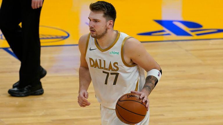 Dallas Mavericks guard Luka Doncic dribbles the ball against the Golden State Warriors 