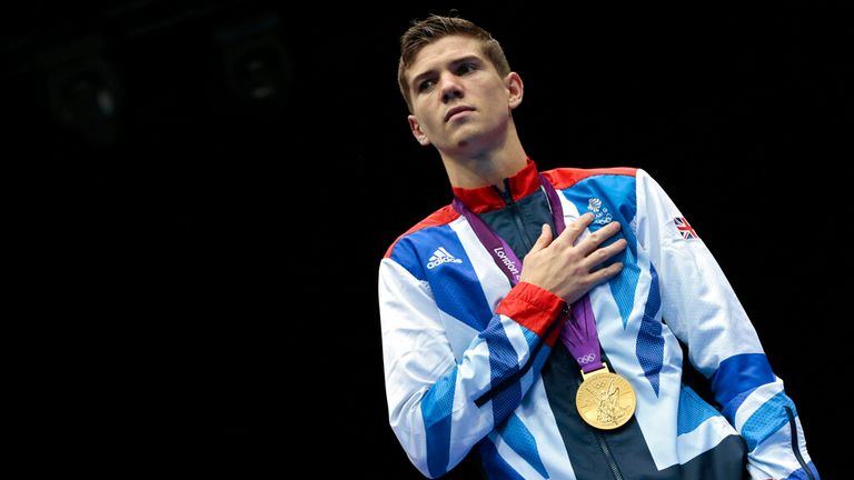 Britain's Luke Campbell stands for his country's anthem after winning the gold medal for the men's bantamweight 56-kg boxing competition at the 2012 Summer Olympics, Saturday, Aug. 11, 2012, in London. (AP Photo/Ivan Sekretarev)