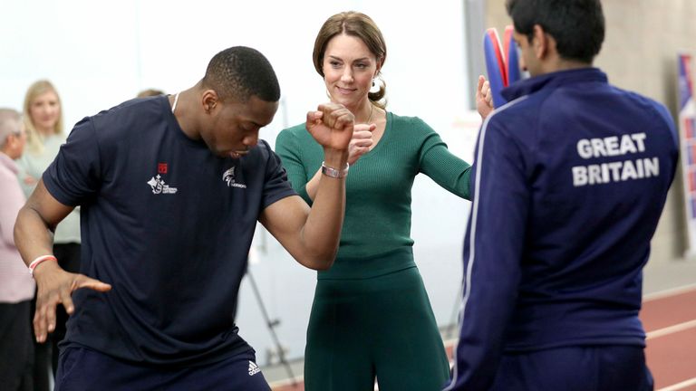 AP: The Duchess of Cambridge is shown Taekwondo moves by Great Britain's Lutalo Muhammad 