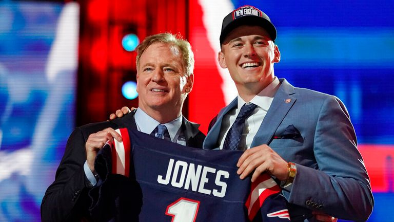 AP - Alabama quarterback Mac Jones, right, holds a team jersey with NFL Commissioner Roger Goodell 