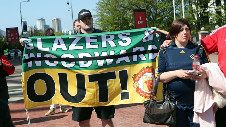 'Glazers & Woodward OUT!' reads one banner on show at Old Trafford during the fan protest