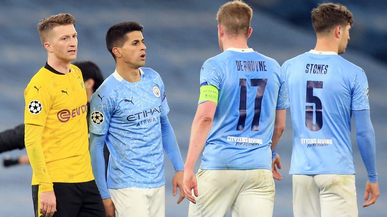06 April 2021, United Kingdom, Manchester: Football: Champions League, Manchester City - Borussia Dortmund, knockout round, quarter-finals, first leg at the Etihad Stadium. Dortmund's Marco Reus (l) says goodbye to City players after the match, including Manchester's Kevin de Bruyne (2.vr). Photo by: Lindsey Parnaby/picture-alliance/dpa/AP Images