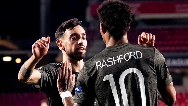 Marcus Rashford celebrates with Bruno Fernandes after opening the scoring against Granada