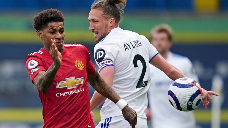 Marcus Rashford and Luke Ayling in Premier League action (AP)