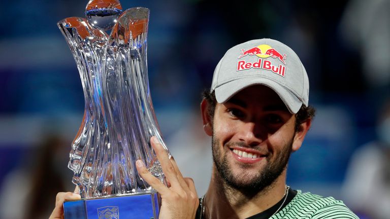 Matteo Berrettini of Italy celebrates with the trophy after winning the final match of the Serbia Open tennis tournament against Aslan Karatsev of Russia in Belgrade, Serbia, Sunday, April 25, 2021. (AP Photo/Darko Vojinovic)
