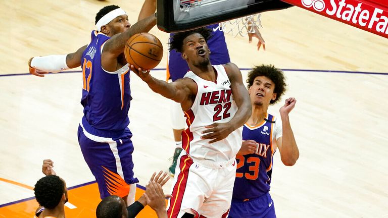 AP - Miami Heat forward Jimmy Butler (22) is fouled by Phoenix Suns forward Torrey Craig