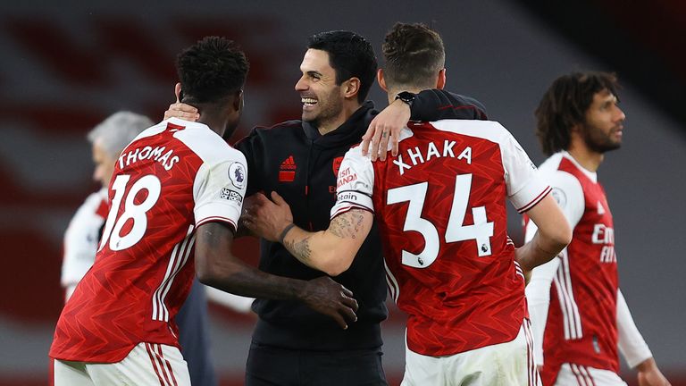 PA - Mikel Arteta embraces his players