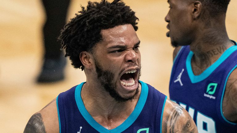 Miles Bridges roars in celebration after throwing down a huge dunk fo the Charlotte Hornets against the Atlanta Hawks