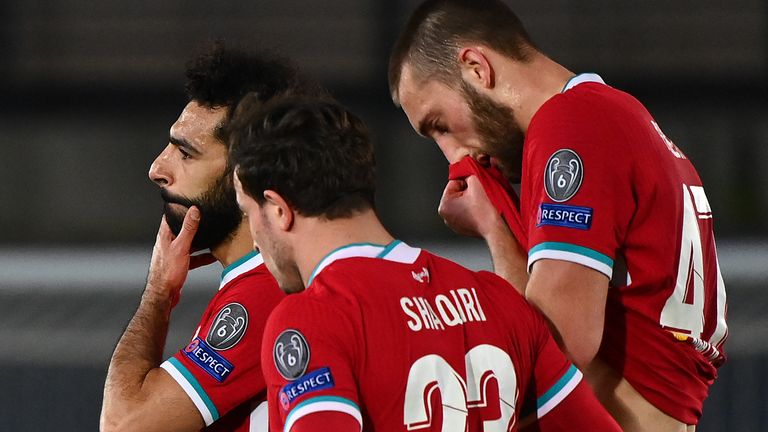 Liverpool's Egyptian midfielder Mohamed Salah, Liverpool's Swiss midfielder Xherdan Shaqiri and Liverpool's English defender Nathaniel Phillips react at the end of the UEFA Champions League first leg quarter-final football match between Real Madrid and Liverpool at the Alfredo di Stefano stadium in Valdebebas in the outskirts of Madrid on April 6, 2021. 