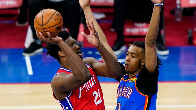 Philadelphia 76ers&#39; Joel Embiid, left, goes up for a shot against Oklahoma City Thunder&#39;s Moses Brown during the second half of an NBA basketball game, Monday, April 26, 2021, in Philadelphia. 