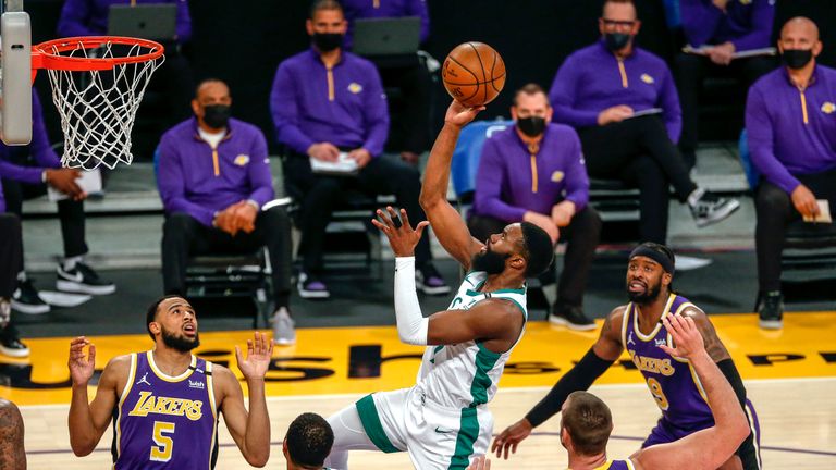 Boston Celtics&#39; Jaylen Brown (7) shoots against the Los Angeles Lakers during the first half of an NBA basketball game Thursday, April 15, 2021, in Los Angeles. (AP Photo/Ringo H.W. Chiu)


