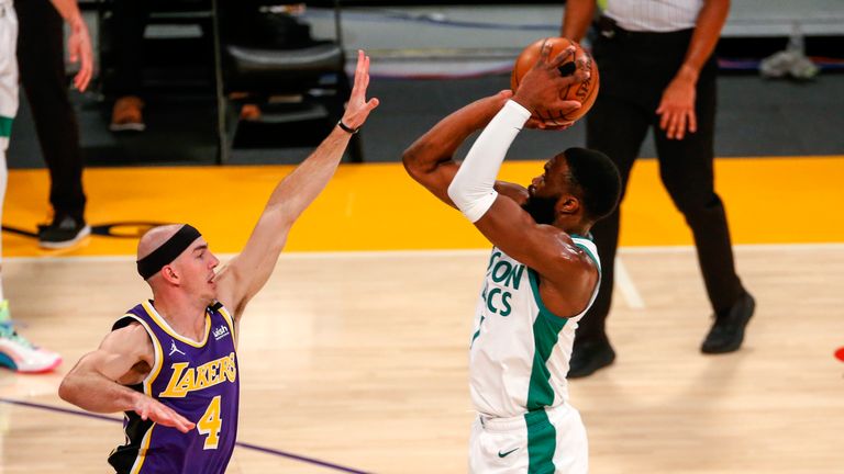 Boston Celtics&#39; Jaylen Brown shoots over Los Angeles Lakers&#39; Alex Caruso (4) during the first half of an NBA basketball game, Thursday, April 15, 2021, in Los Angeles. (AP Photo/Ringo H.W. Chiu)


