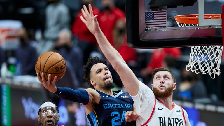 Memphis Grizzlies forward Dillon Brooks, left, shoots over Portland Trail Blazers center Jusuf Nurkic during the second half of an NBA basketball game in Portland, Ore., Sunday, April 25, 2021. (AP Photo/Craig Mitchelldyer)


