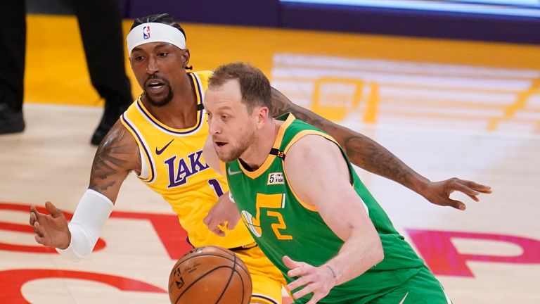 Utah Jazz guard Joe Ingles (2) dribbles past Los Angeles Lakers guard Kentavious Caldwell-Pope (1) during the first half of an NBA basketball game Monday, April 19, 2021, in Los Angeles. (AP Photo/Marcio Jose Sanchez) 