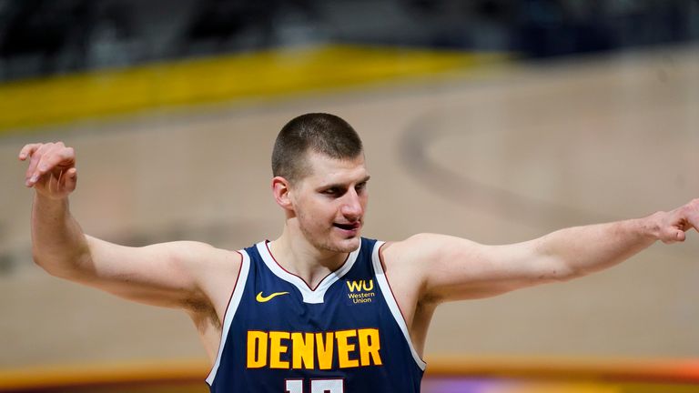 Denver Nuggets center Nikola Jokic gestures to fans after an NBA basketball game against the Memphis Grizzlies, Monday, April 19, 2021, in Denver. The Nuggets prevailed 139-137 in double overtime. (AP Photo/David Zalubowski)


