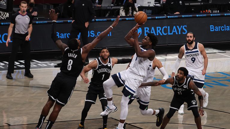 Anthony Edwards of the Minnesota Timberwolves shoots over Jeff Green of the Brooklyn Nets during their game at the Barclays Center on March 29, 2021 in New York City