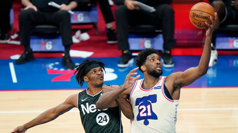Philadelphia 76ers&#39; Joel Embiid, right, goes up for a shot Brooklyn Nets&#39; Alize Johnson during the second half of an NBA basketball game, Wednesday, April 14, 2021, in Philadelphia. (AP Photo/Matt Slocum)


