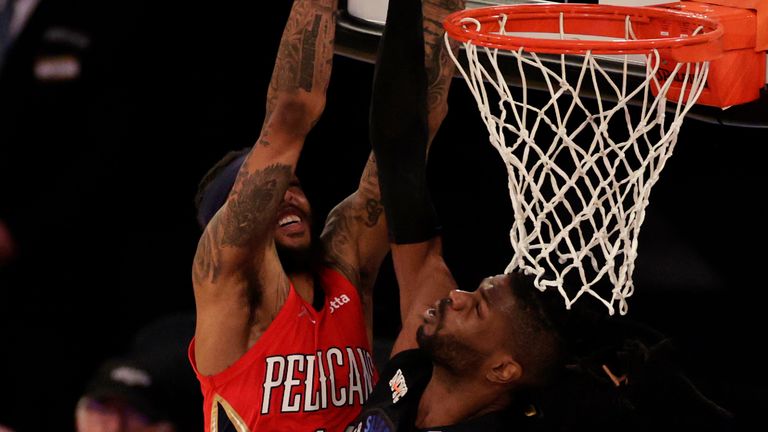 New Orleans Pelicans forward Brandon Ingram, left, has his shot blocked by New York Knicks center Nerlens Noel, right, during overtime of an NBA basketball game Sunday, April 18, 2021, in New York. (AP Photo/Adam Hunger, Pool) 