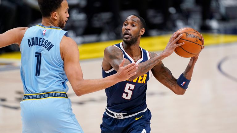 Denver Nuggets forward Will Barton, right, drives to the rim as Memphis Grizzlies forward Kyle Anderson defends in the second half of an NBA basketball game Monday, April 19, 2021, in Denver. (AP Photo/David Zalubowski) 