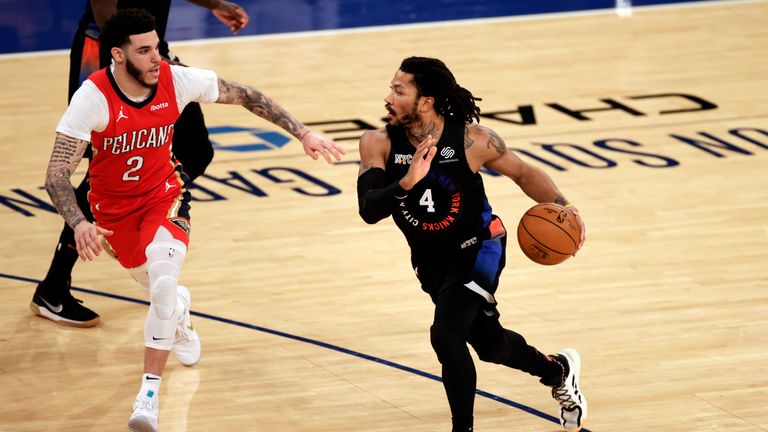 New York Knicks guard Derrick Rose (4) drives to the basket past New Orleans Pelicans guard Lonzo Ball (2) during the second half of an NBA basketball game Sunday, April 18, 2021, in New York. The Knicks won in overtime 122-112. (AP Photo/Adam Hunger, Pool) 