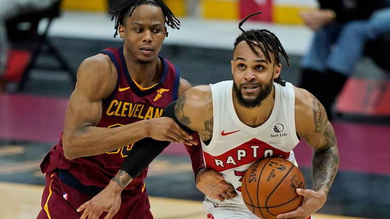 Toronto Raptors&#39; Gary Trent Jr., right, drives to the basket against Cleveland Cavaliers&#39; Isaac Okoro in the second half of an NBA basketball game, Saturday, April 10, 2021, in Cleveland. 