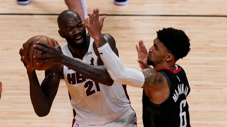 Houston Rockets forward Kenyon Martin Jr. (6) defends Miami Heat center Dewayne Dedmon (21), during the second half of an NBA basketball game, Monday, April 19, 2021, in Miami. (AP Photo/Marta Lavandier) 