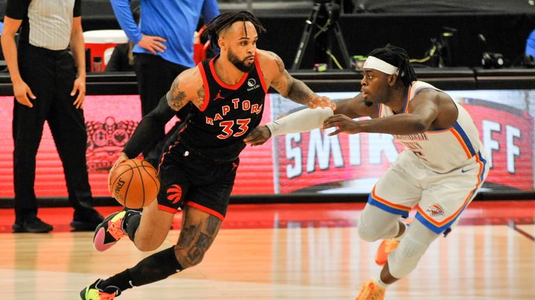 Toronto Raptors' Gary Trent Jr. (33) moves upcourt under pressure from Oklahoma City Thunder's Luguentz Dort (5) during the fourth quarter of a basketball game Sunday, April 18, 2021, in St. Petersburg, Fla. (AP Photo/Steve Nesius) 