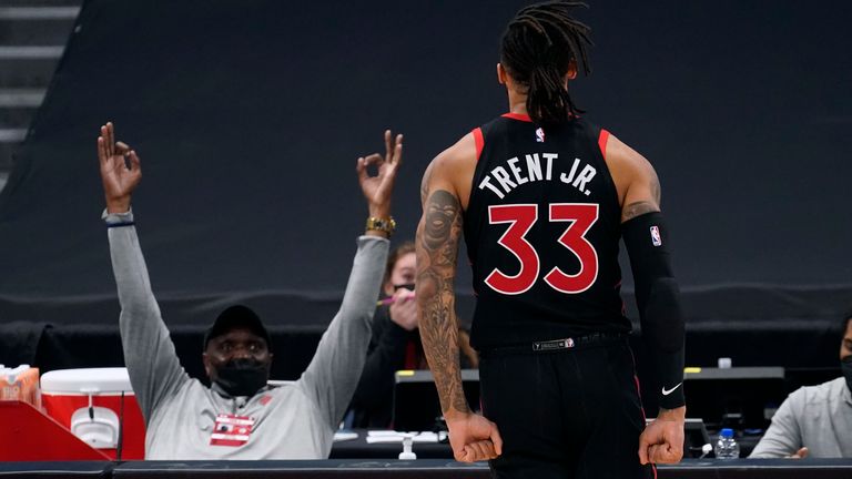 Toronto Raptors guard Gary Trent Jr. (33) celebrates after making the game-winning, three-point basket during the second half of an NBA basketball game against the Washington Wizards Monday, April 5, 2021, in Tampa, Fla. 