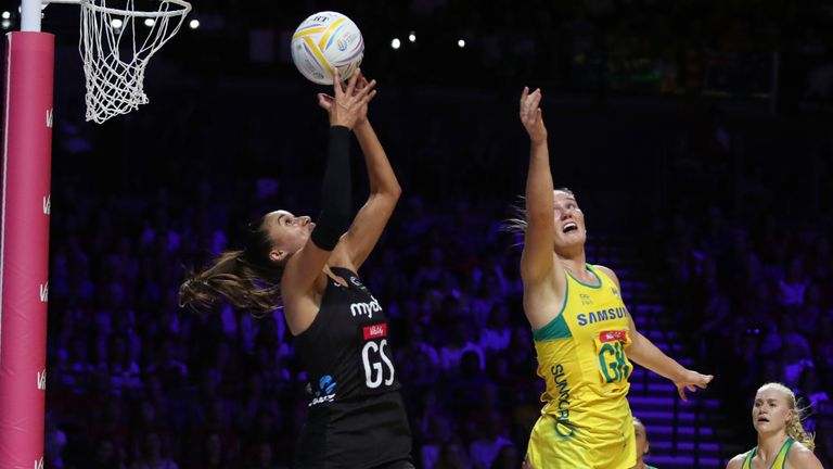 New Zealand's Maria Folau, left, and Australia's Courtney Bruce vie for the ball during the 2019 Netball World Cup final