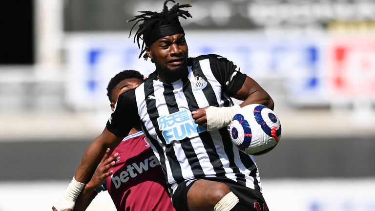 Newcastle...s Allan Saint-Maximin kicks the ball away from West Ham&#39;s Ben Johnson, left, during the English Premier League soccer match between Newcastle United and West Ham United at St James&#39; Park, Newcastle, England, Saturday April 17, 2021. (AP Photo/Stu Forster/Pool)..