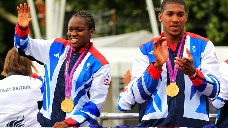Nicola Adams and Anthony Joshua parade their gold medals