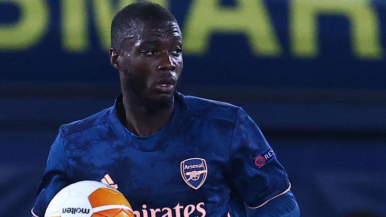 Nicolas Pepe retrieves the ball after scoring for Arsenal from the penalty spot