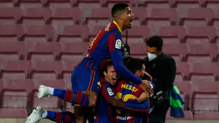 Ousmane Dembele celebrates with his team-mates after his injury time goal secured victory