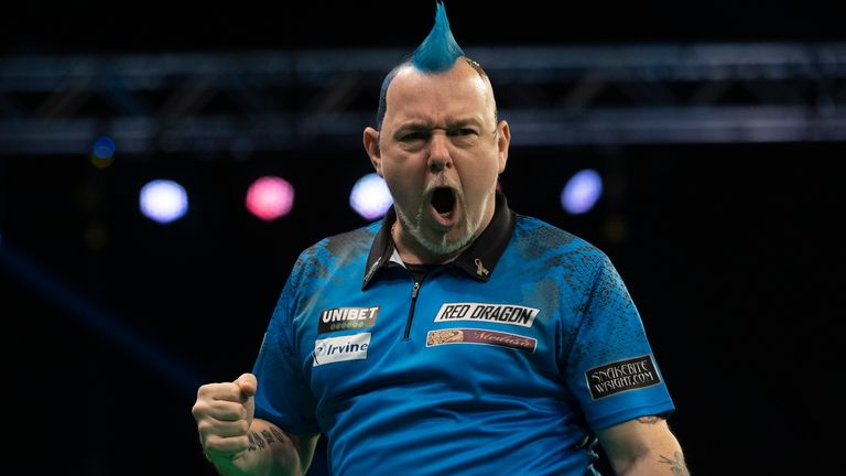 Peter Wright takes on Michael van Gerwen on Night Two of the Premier League after some high profile mind games between the pair (Image: Lawrence Lustig/PDC)